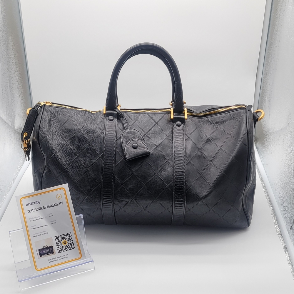 CHANEL Quilted Black Travel Bag with Gold Details